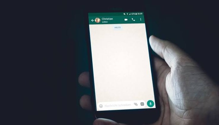 An undated image of a person using WhatsApp. – Unsplash