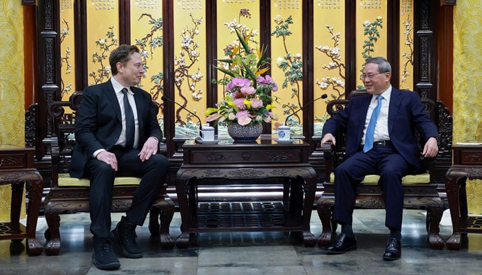 Tesla CEO Elon Musk (L) met with Chinese Premier Li Qiang in Beijing on Sunday, April 28, 2024. — Xinhua