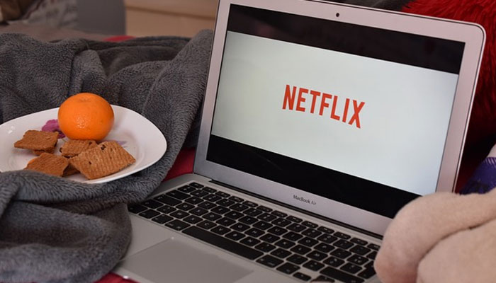 An undated image of a person looking at the Netflix screen on laptop. — Pixabay