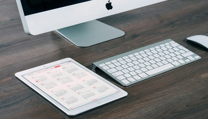 An undated image displaying Magic Keyboard next to an iPad. — Pexels