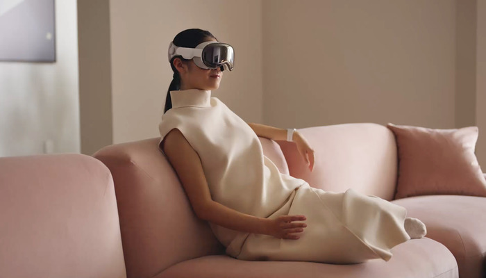 An undated image of a girl wearing Vision Pro headset. — Apple