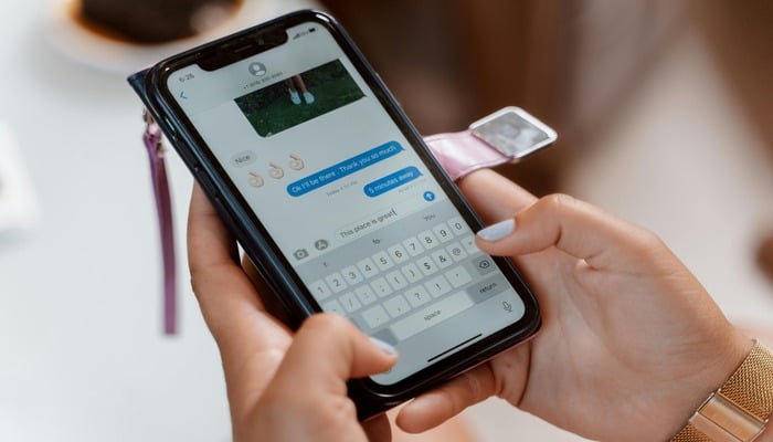 An undated image of a person sending text message. — Unsplash