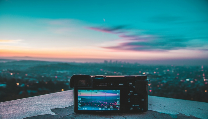 An undated image of a camera capturing sky. — Pexels