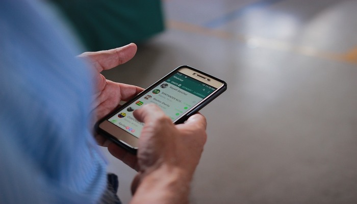 An undated image of a person using WhatsApp. — Pixabay