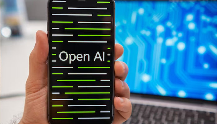 A representational image of OpenAI home page didplayed on a mobile screen. — Freepik