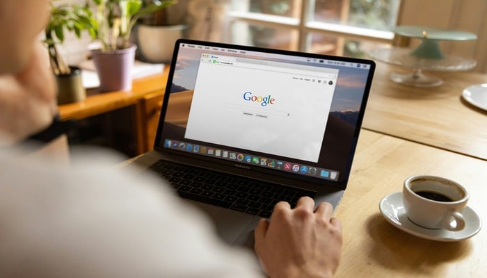 An undated image of a person using Google. — Unsplash