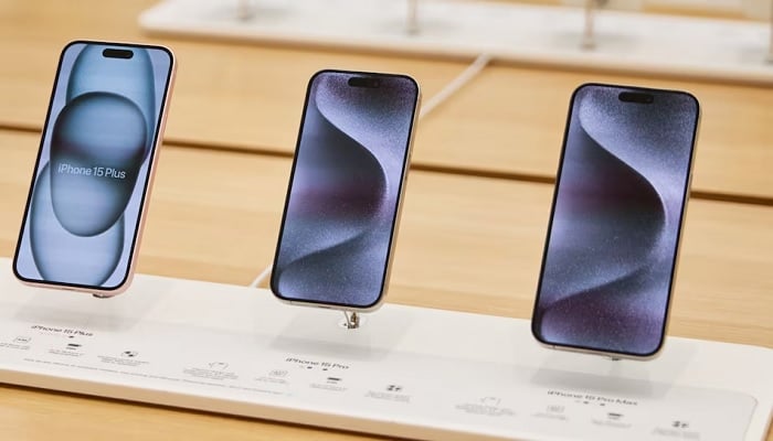The image shows iPhone 15 Plus, iPhone 15 Pro, and iPhone 15 Pro Max. — Apple