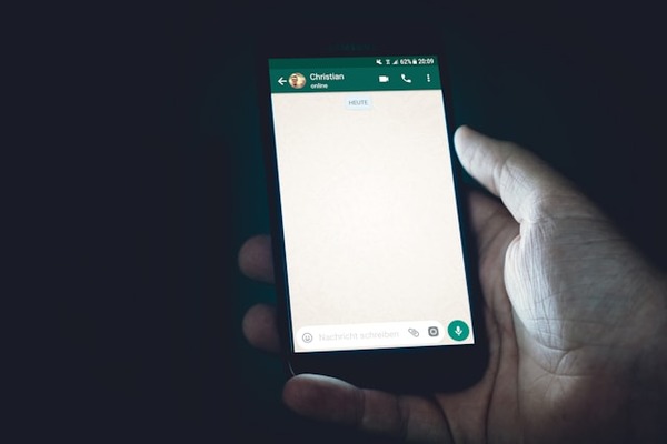 An undated image of a person using WhatsApp. — Unsplash