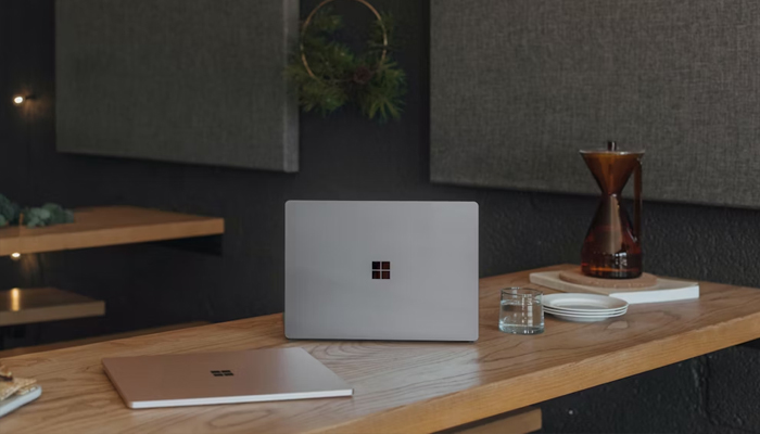 An undated image showing Microsoft laptops placed on table. — Unsplash