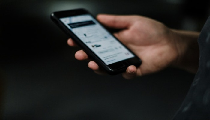 An undated image of a person using an Android phone. — Unsplash