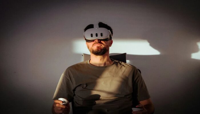 An undated image showing a man using VR. — Unsplash