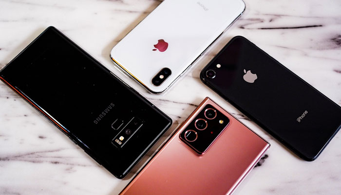 An undated image of Samsung and Apple mobile phones displayed on a table. — Pixabay