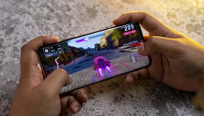 An undated image of a person playing a game on Android. — Unsplash