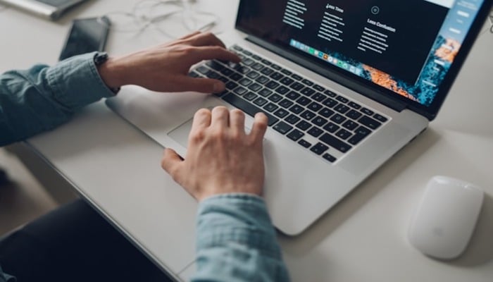 An undated image of a person using a laptop. — Unsplash