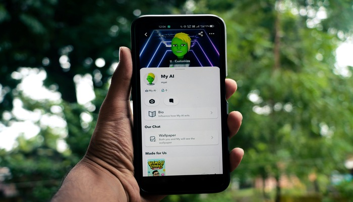 An undated image of a person holding a phone using Snapchat. — Pexels