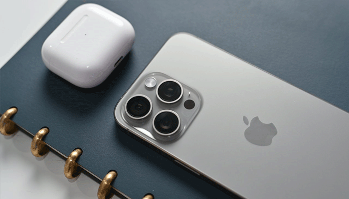 An undated image showing iPhone 15 Pro Max along with Airpods Pro. — AppleInsider