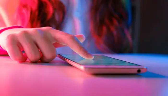 An undated image of a pink phone. — Unsplash
