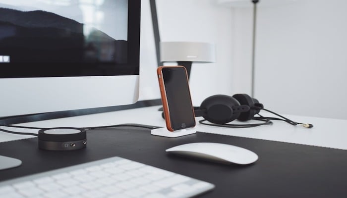 An undated image of a smartphone and a headphone. — Unsplash