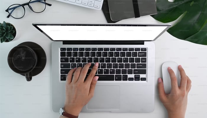 An undated image showing a man using a laptop. — Unsplash
