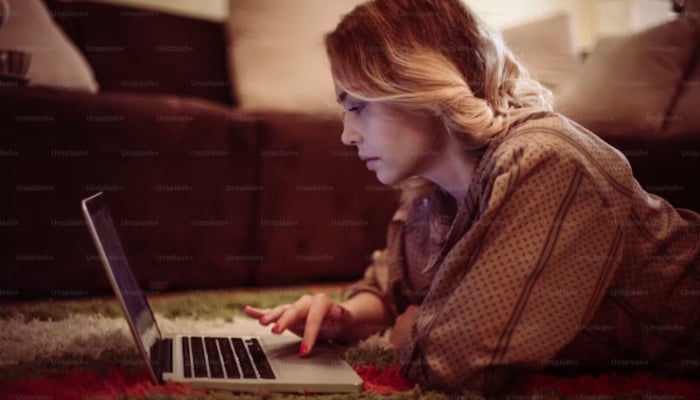 An undated image of a woman using a laptop. — Unsplash