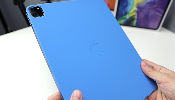 An undated image of a person holding an iPad case. — Unsplash