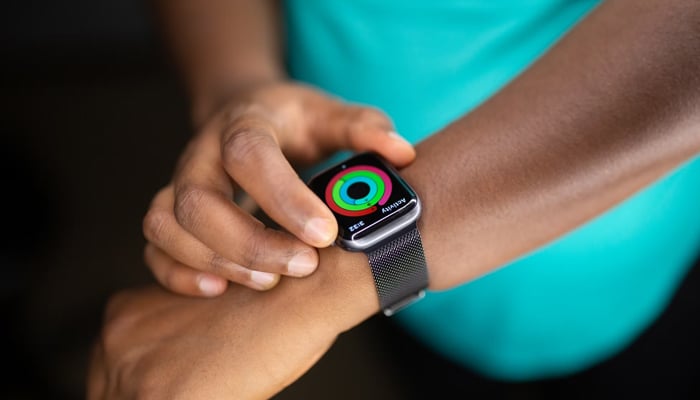 An undated image showing a fitness tracker on a persons hand. — Unsplash