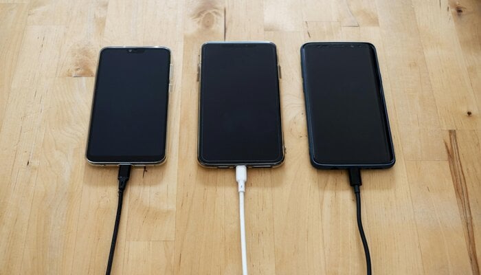 An undated image of smartphones plugged in to charge. — Pexels