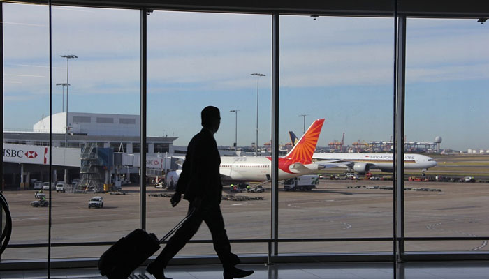 An undated image of a passenger walking through the aisle. — Pixabay
