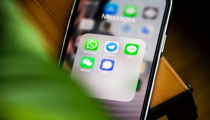 An undated image of a person using Apple apps. — Unsplash
