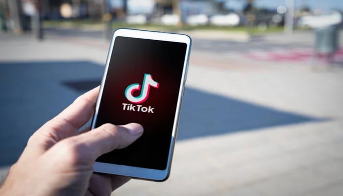 An undated image of the TikTok logo displayed on a mobile screen. — Deposit Photos