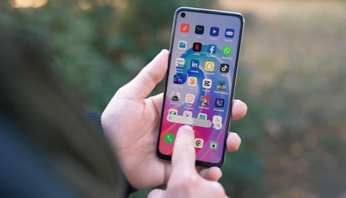 An undated image of a person using an Android phone. — Unsplash