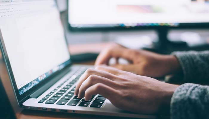An undated image of a person using a laptop. — Unsplash