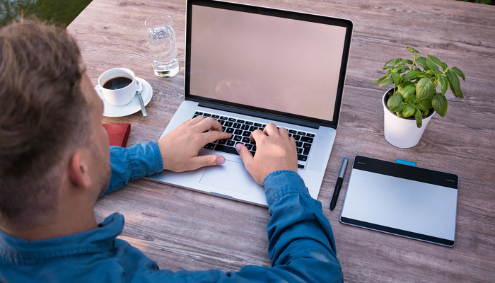 An undated image showing man using laptop. — Unsplash