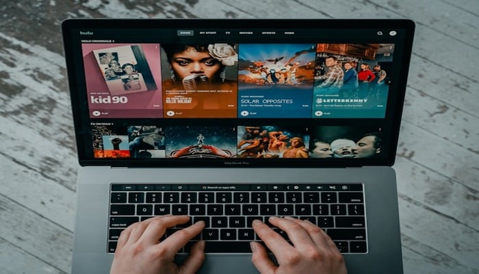 An undated image of a person using Hulu app on a laptop. — Unsplash