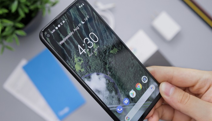 An undated image of a person holding a smartphone. — Unsplash