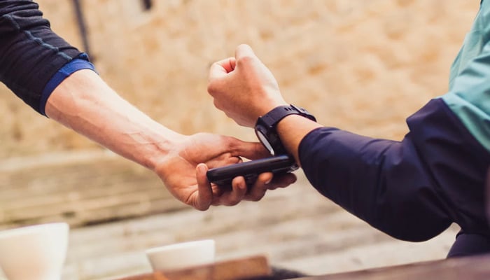 An undated image of a person wearing a Garmin watch. Garmin App Store