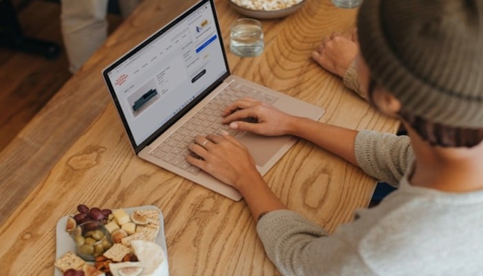 An undated image of a person using a laptop. — Unsplash