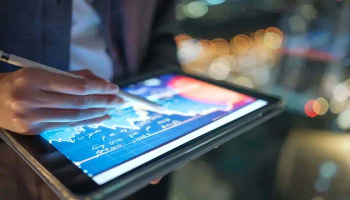 An undated image of a person using a tablet. — Unsplash