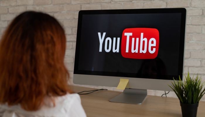 An undated image of a person watching YouTube. — Canva