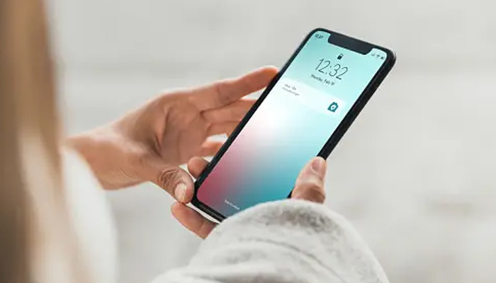 An undated image showing iPhone in a hand. — Unsplash