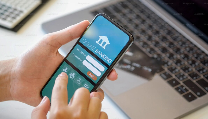 An undated image of online banking app interface on a mobile. — Unsplash