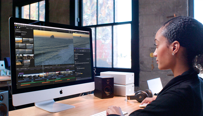 An undated image showing a girl using Final Cut Pro app on Mac system. — Apple