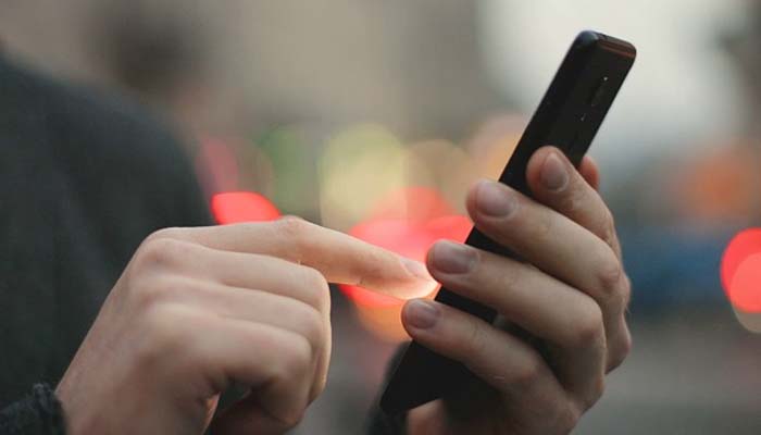 An undated image of a person using a Motorolas phone. — Pixabay