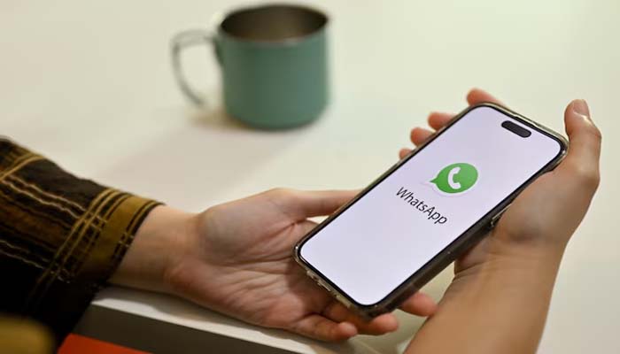 An undated image of a person using WhatsApp. — Freepik