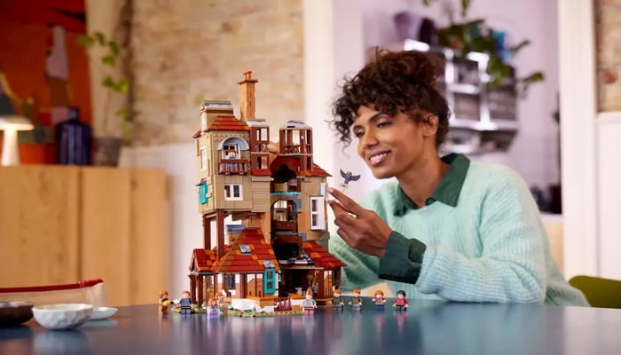 An undated image of a girl playing the LEGO Potter Collection. — LEGO
