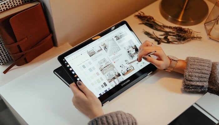 An undated image of a person using Samsung Tab. — Unsplash