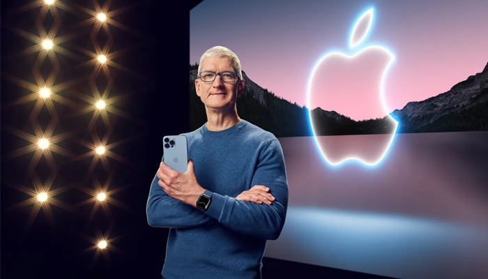 An undated image of Apple CEO Tim Cook holding an iPhone. — Apple