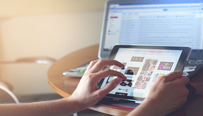 An undated image of a person using an iPad. — Unsplash