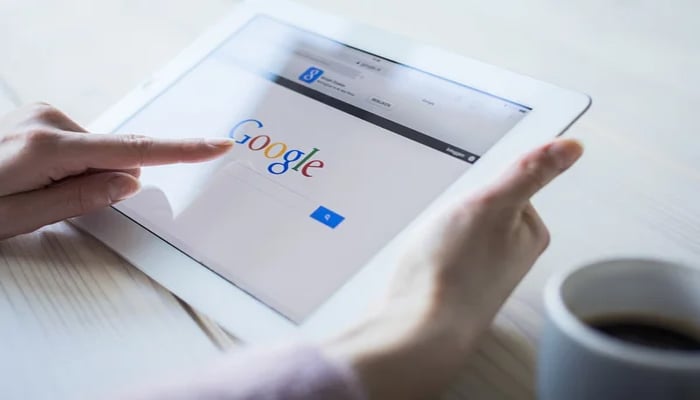 An undated image showing a person using Google. — Depositphotos