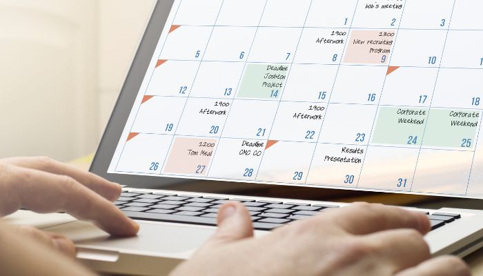 An undated image of a person scheduling. — Canva